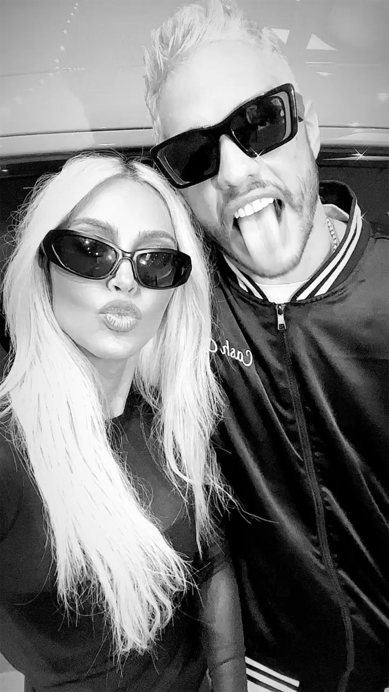 Kim Kardashian and Pete Davidson stick out their tongues while wearing sunglasses on Instagram.