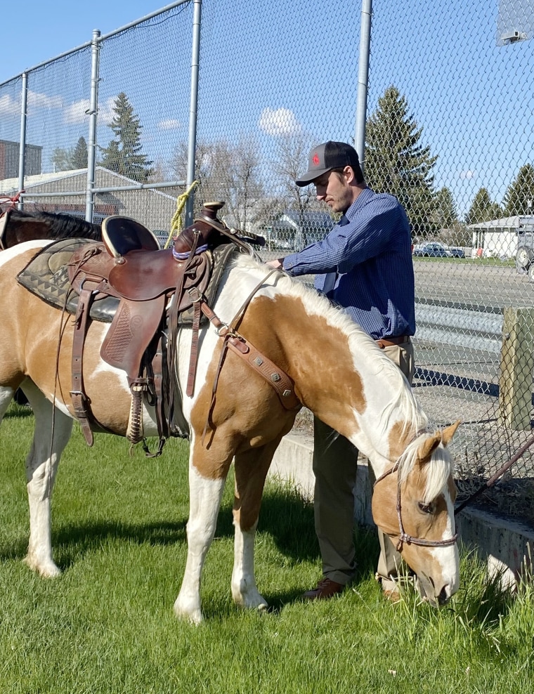 Principal Raymond DeBruycker tended to a horse.