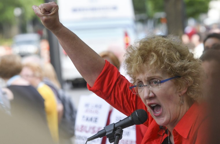 In this Tuesday, June 11, 2019 file photo, Christa Brown, of Denver, Colo., speaks during a rally in Birmingham, Ala., outside the Southern Baptist Convention's annual meeting. 