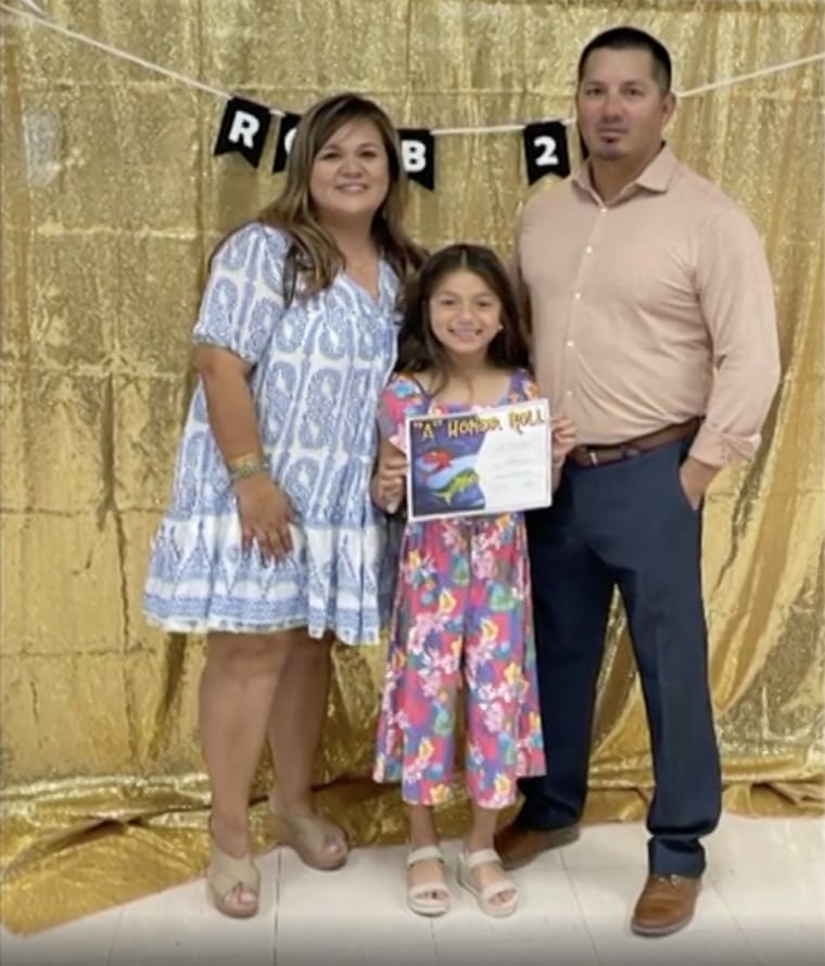 Jacob Aldarado with his wife and daughter, both of whom made it out of the shooting alive.