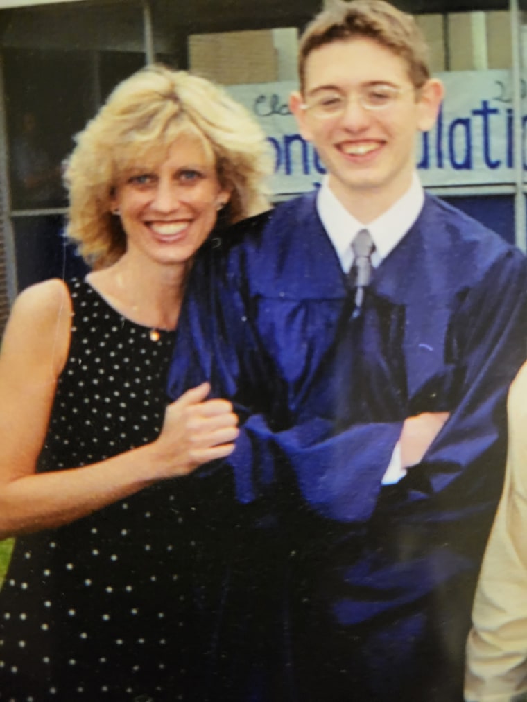 Black with her late son at his graduation.