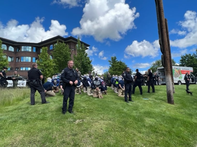 Police in Coeur d'Alene, Idaho, detain people pulled Saturday, June. 11, 2022, from a U-Haul truck near the city's Pride celebration.
