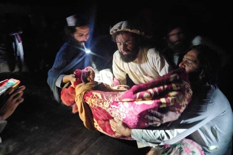Afghans evacuate the wounded after an earthquake in the province of Paktika on Wednesday.