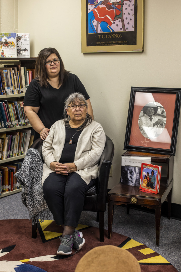 Gloria Runs Close To Lodge-Goggles in the indigenous section of the library with her daughter Jennifer Runs Close To Lodge at the Wyoming Indian Middle School in Ethete, Wy., on April 26, 2022.