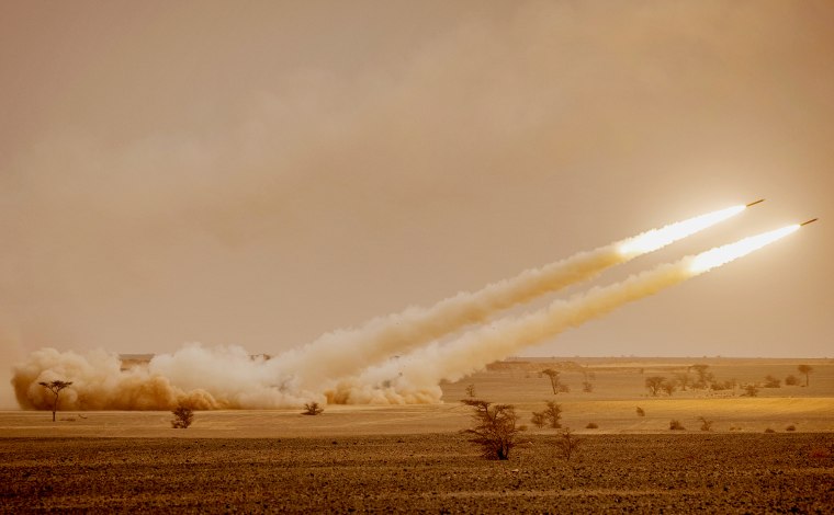 US M142 High Mobility Artillery Rocket System (HIMARS) launchers fire salvoes during the "African Lion" military exercise in southeastern Morocco