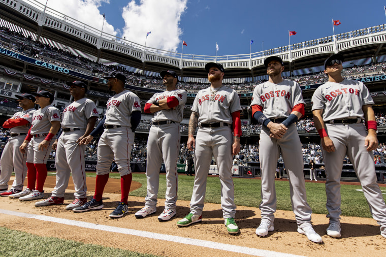 Boston Red Sox players line up before the opening day game against the New York Yankees on April 8, 2022, at Yankee Stadium in the Bronx, N.Y.