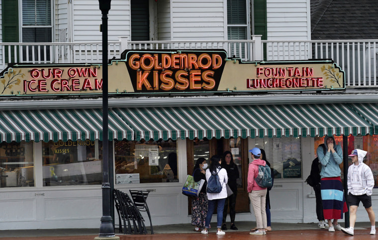 Image: High school students gather outside The Goldenrod, a popular restaurant and candy shop, Wednesday, June 1, 2022, in York Beach, Maine.