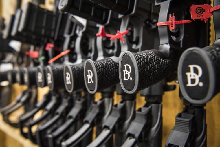 A row of AR-15 style rifles manufactured by Daniel Defense sit in a vault at the company's headquarters in Black Creek, Ga., on March 9, 2017.