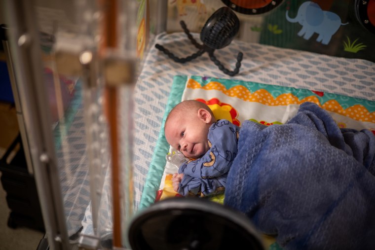 Jameson Hardee lays in an infant metabolic chamber.