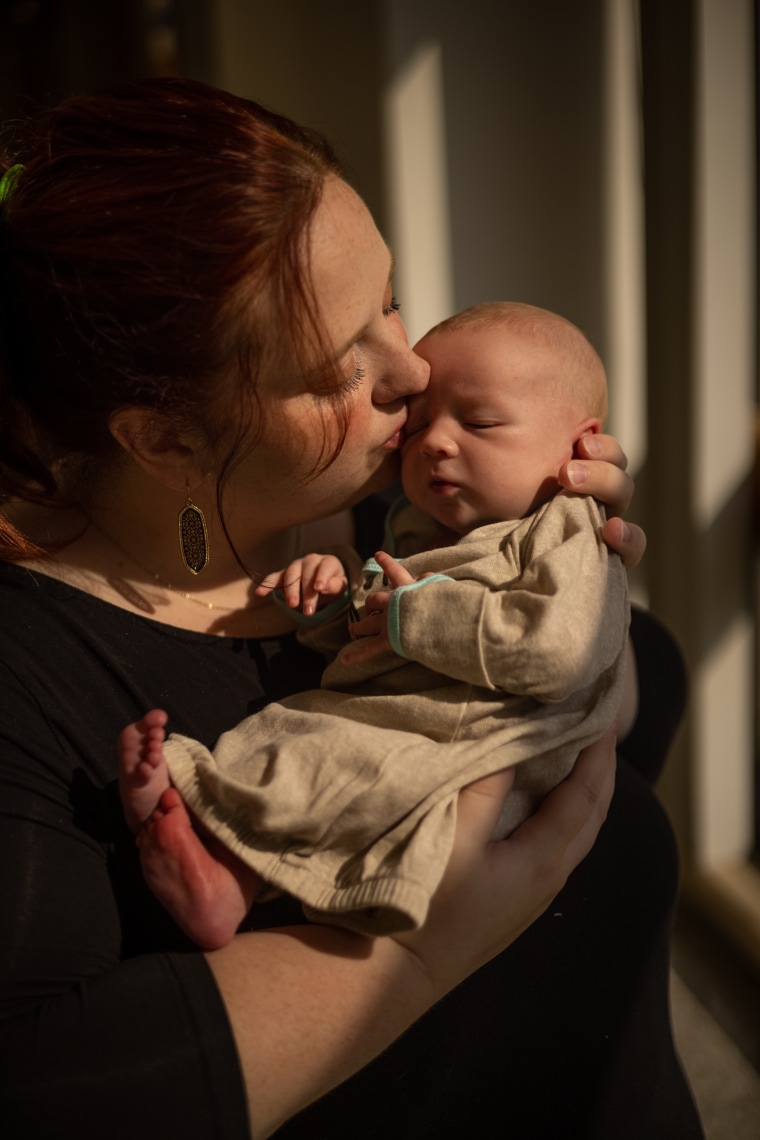 Julie Hardee holds her son Jameson at the Pennington Biomedical Research Center at Louisiana State University in Baton Rouge on May 12, 2022.