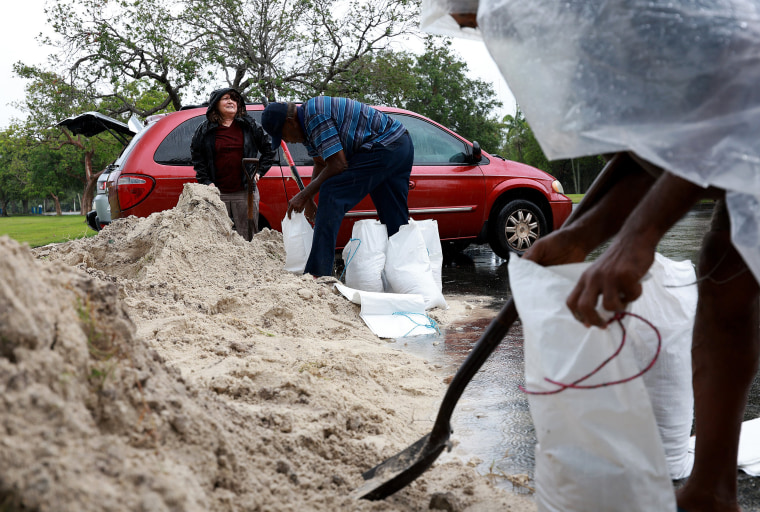 Image: People fill sandbags at Mills Pond Park as they prepare for the expected arrival of Tropical Storm Alex on June 3, 2022 in Fort Lauderdale, Fla.