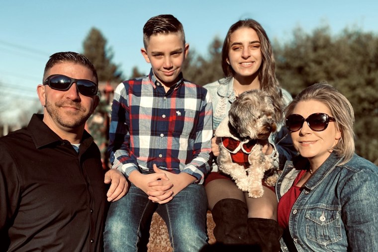 The Spence family, from left, Jeffrey, Ryan, Alexis, Kathleen and their dog, Draco.
