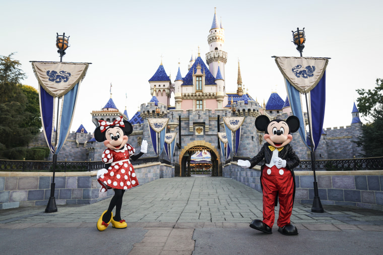 Minnie Mouse and Mickey Mouse in front of the Disney Castle on Sept. 30, 2021.