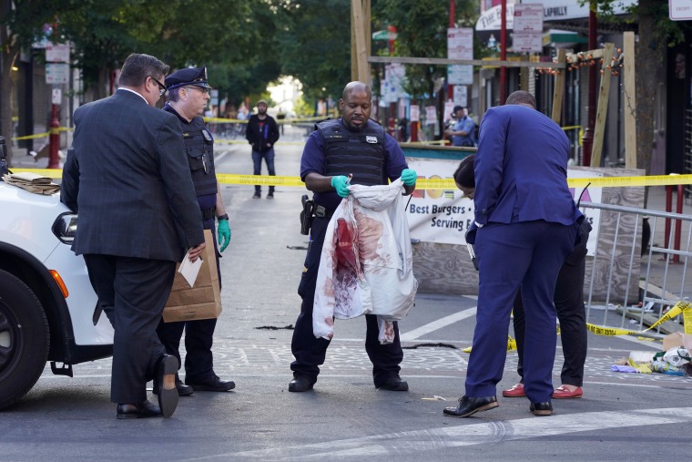 Philadelphia police at the scene Sunday of a fatal overnight shooting. 