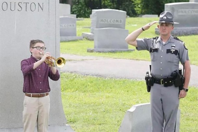 A photo provided by Calloway County Sheriff Nicky Knight shows then-Trooper Jody Cash and his son, Jackson, during a National Police Week Peace Officer Memorial ceremony.