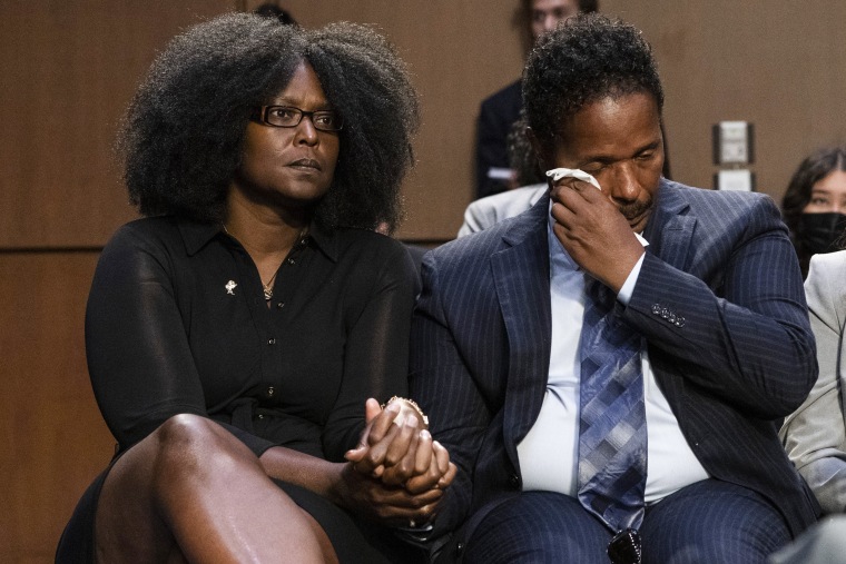 Raymond Whitfield, right, wipes his eyes as his brother Garnell Whitfield, Jr., of Buffalo, N.Y., talks about their mother Ruth Whitfield who was killed in the Buffalo Tops supermarket mass shooting during a Senate Judiciary Committee hearing on domestic terrorism on June 7, 2022. Zeneta Everhart, left, whose son Zaire Goodman, 20, was shot in the neck during the shooting and survived listens.