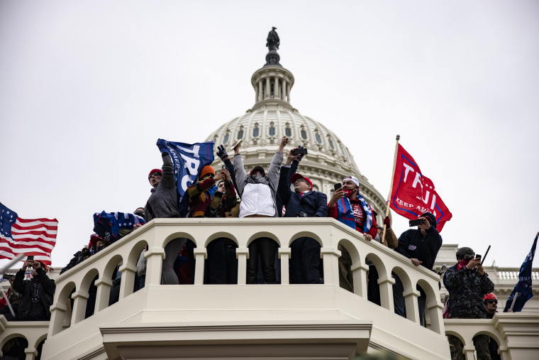 Image: Pro-Trump supporters on the steps of the Capitol in Washington following a rally with President Donald Trump on Jan. 6, 2021.