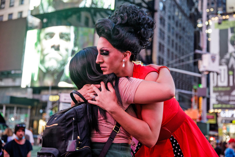 Karinina Quimpo, left, hugs Marti Cummings during a vigil for Julio Ramirez on June 8, 2022, in New York.