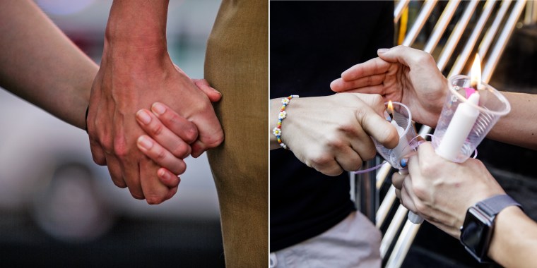 Karinina Quimpo, left, holds hands with Chris Lebron at the vigil.