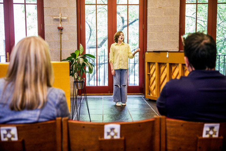 Diane and Mike Coppola watch their child, Michael, during a voice lesson at Trinity Lower East Side Lutheran Parish in New York on May 28, 2022.