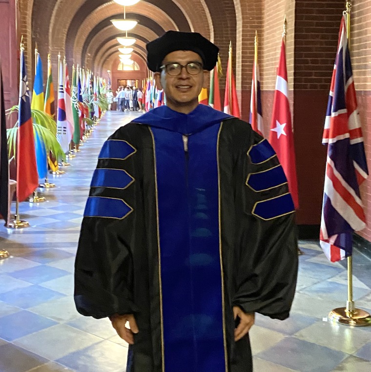 Abel Cruz Flores wearing his regalia the day of his Ph.D. graduation from Georgetown University on May, 19.