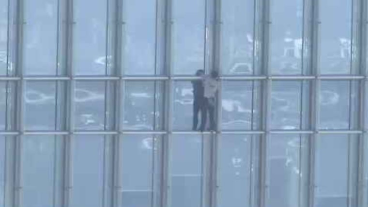 A man climbs Devon Tower in Oklahoma City