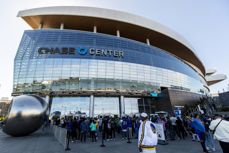 Fans arrive at the Chase Center before Game 1 of basketball's NBA Finals between the Golden State Warriors and the Boston Celtics in San Francisco, on June 2, 2022.
