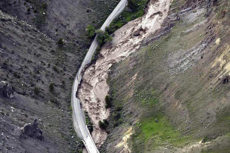 The highway between Gardiner and Mammoth in Montana is washed out, trapping tourists in Gardiner, Mont., on June 13, 2022.  
