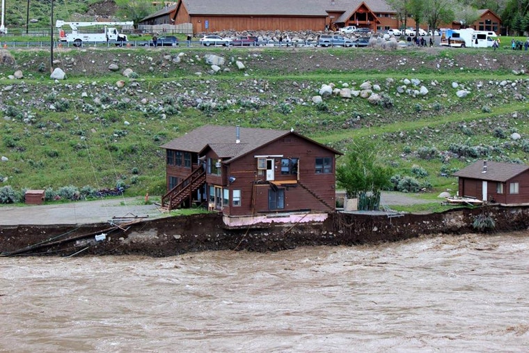 The Yellowstone River threatens a house in Gardiner, Mont., on June 13, 2022.