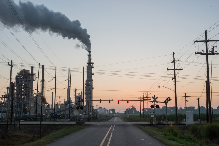 Image: Smoke billows from one of many chemical plants in the area known as "Cancer Alley: in Baton Rouge, La., on Oct. 12, 2013.