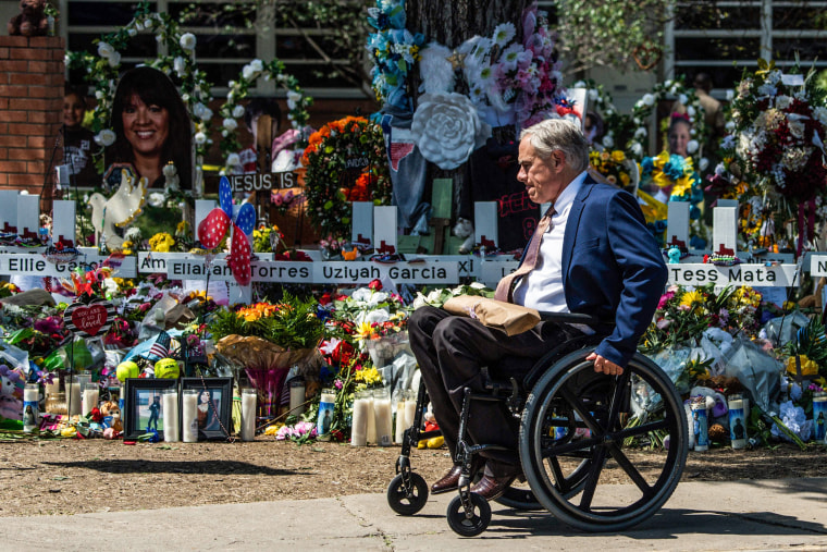 Image: Texas Governor Greg Abbott arrives at a makeshift memorial outside of Robb Elementary School in Uvalde, Texas on May 29, 2022.