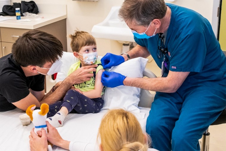 Three-year-old Andel was the first youngster to receive the Pfizer-BioNTech Covid-19 vaccine at Stanford Medicine. His parents, Otavio and Zina Good, enrolled him in a clinical trial for children aged 6 months through 4 years. Steve Fisch / Stanford Medicine
