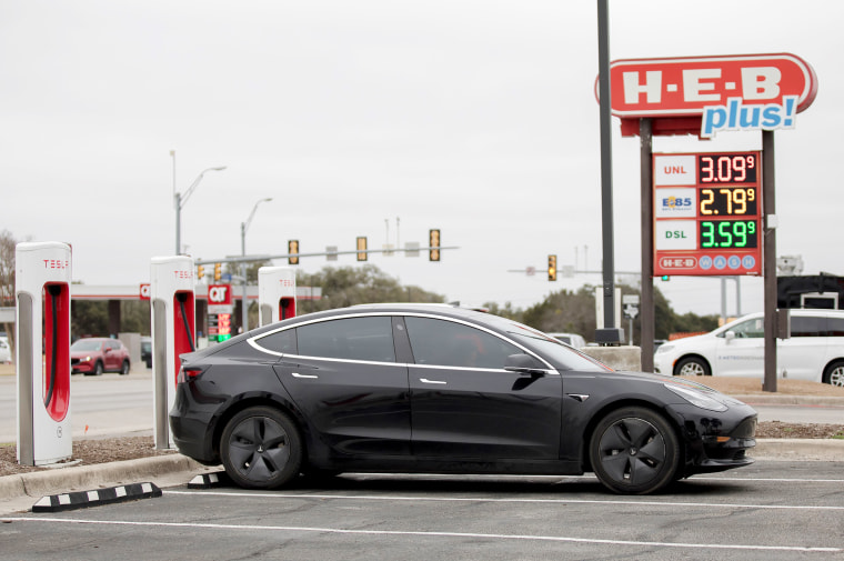 A Tesla electric car charges