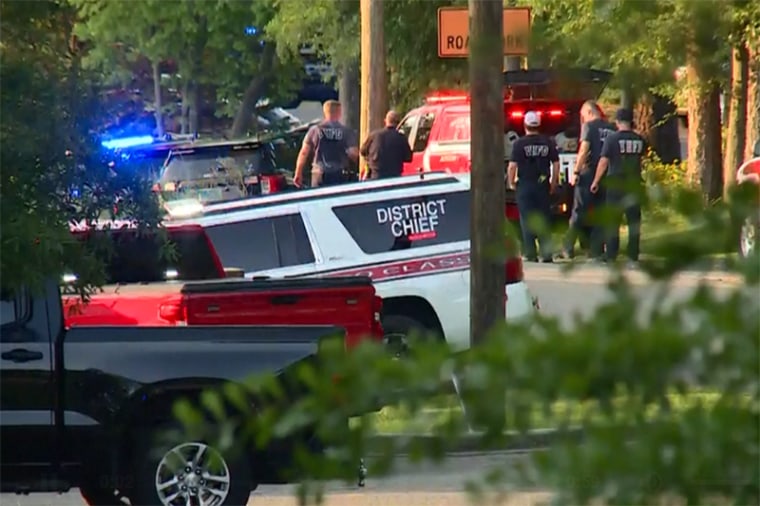 Emergency personnel gather near the St. Stephens Episcopal Church in Vestavia Hills, Al. after a shooting Thursday.