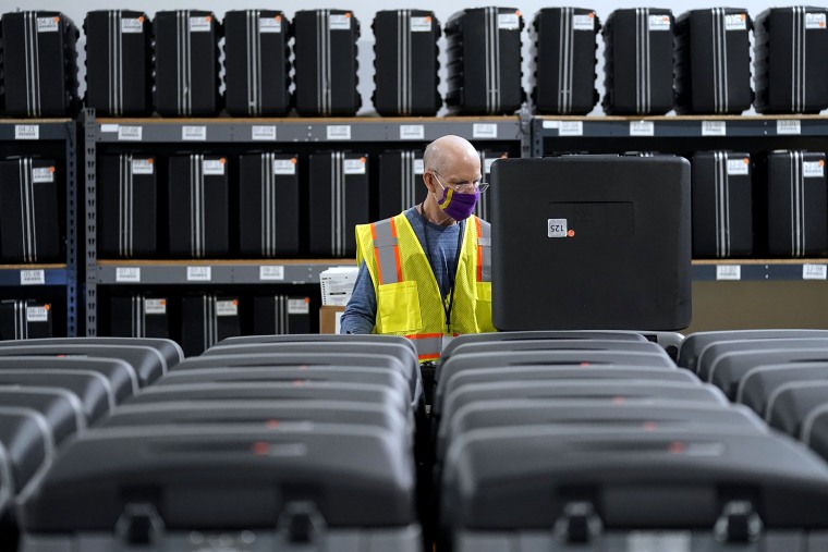 A worker prepares tabulators for the election at the Wake County Board of Elections in Raleigh, N.C., on Sept. 3, 2020.