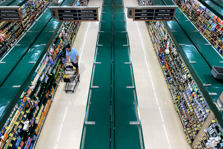People shop at a supermarket in Arlington, Va., on June 10, 2022.