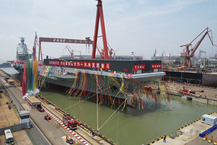 China’s third aircraft carrier was christened Fujian at a dry dock in Shanghai on Friday.