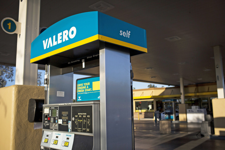 Signage is displayed on a fuel pump at a Valero Energy Corp. gas station
