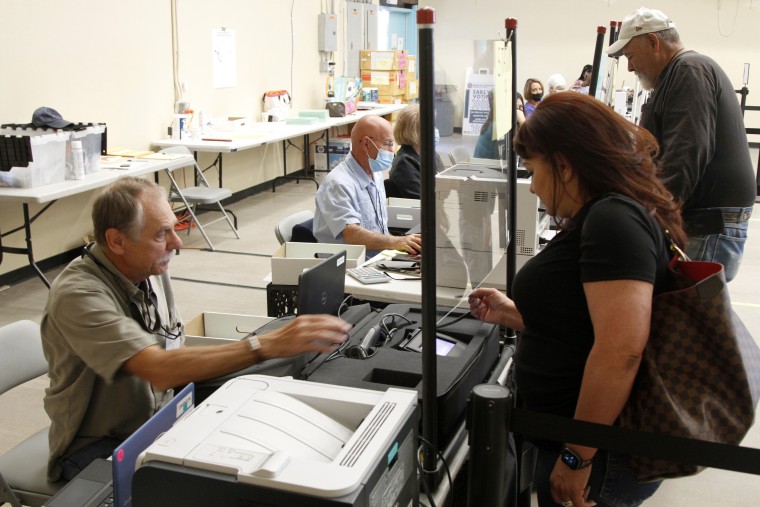 Ballots are cast at an early voting center in Santa Fe, N.M., on June 1, 2022.