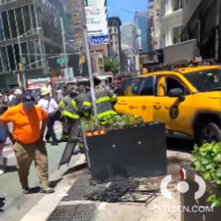 New York firefighters respond to a taxi accident in the Flatiron district in N.Y., on Monday.