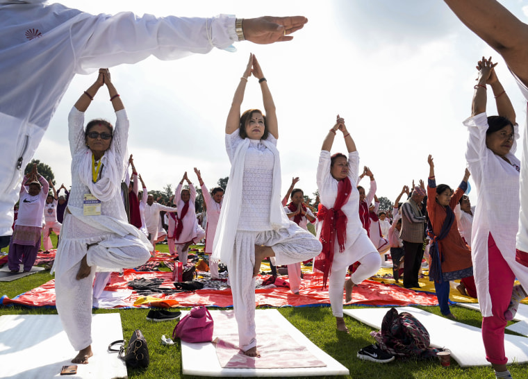 Image: People practice yoga to mark International Day of Yoga in Kathmandu, Nepal, on June 21, 2022.