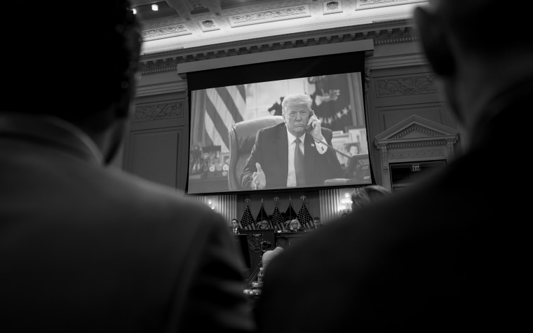 Image: Photos of then-President Donald Trump are showing during a House Select Committee hearing on the attack at the Capitol on Jan. 6 on June 16, 2022.