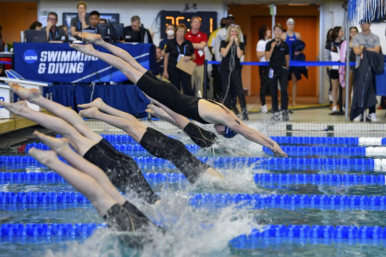 University of Pennsylvania swimmer Lia Thomas dives past the other swimmers during the 100-meter freestyle preliminaries at the NCAA swimming and diving championships in Atlanta on March 19.