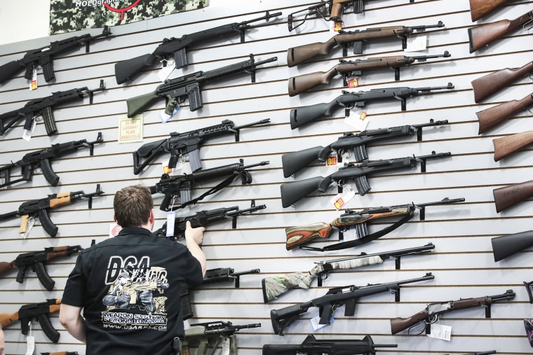 Image: Guns are displayed inside the DSA Inc. store in June, 2016 in Lake Barrington, Illinois.