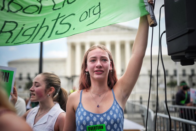 An abortion rights advocate cries outside the Supreme Court on Friday.