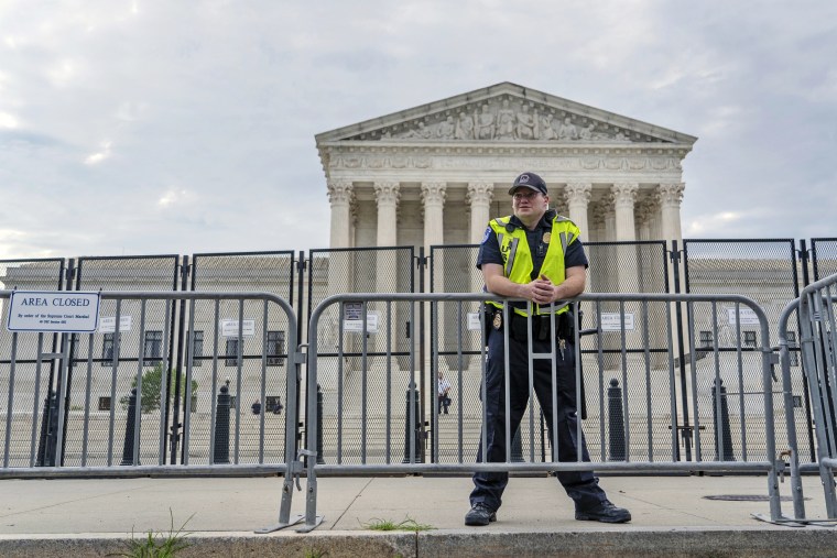 A U.S Supreme Court Police officer stands guard outside the Supreme Court on June 13, 2022.