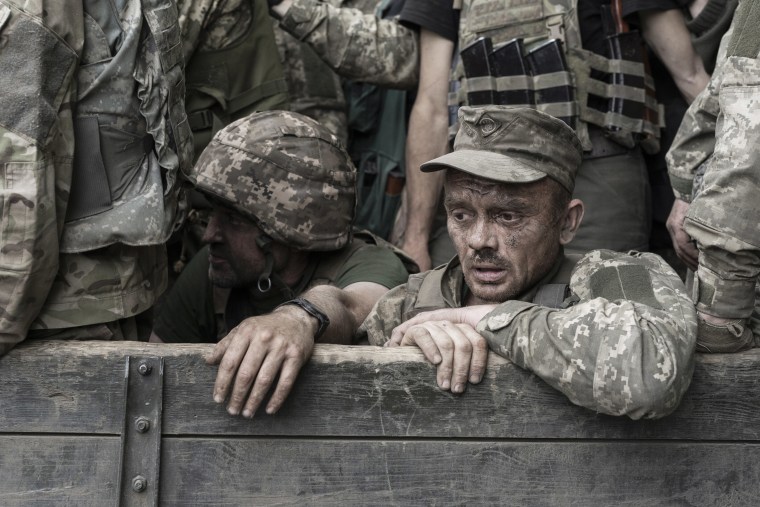 A troop carrier full of Ukrainian soldiers returns from the front line in Sievierodonetsk, on June 22, 2022. 