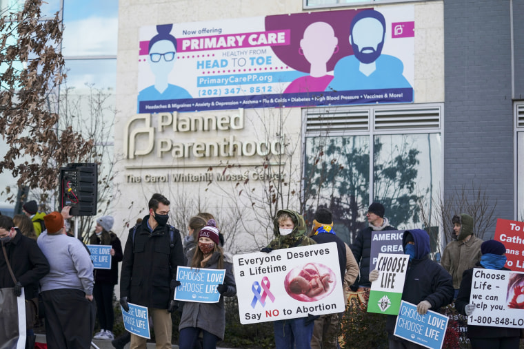 Anti-abortion demonstrators gather at a Planned Parenthood