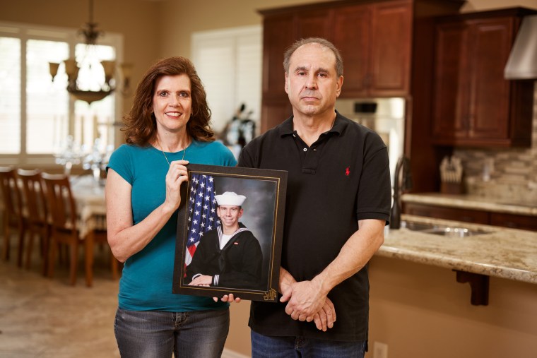 Teri and Patrick Caserta hold a portrait of their son, Brandon Caserta