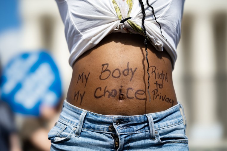 An abortion rights demonstrator protests outside the Supreme Court